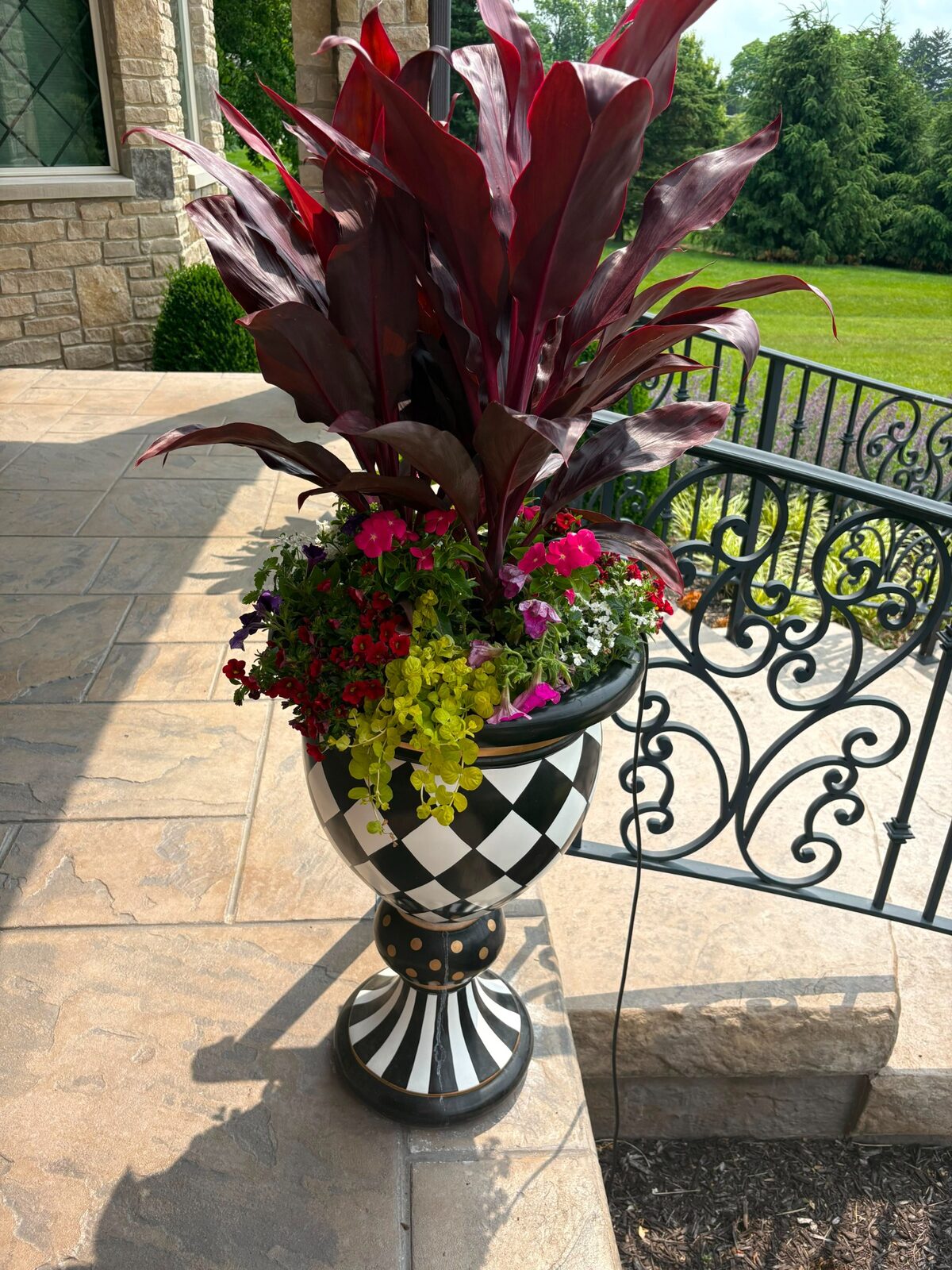 Luxury porch planter by M&J Landscaping